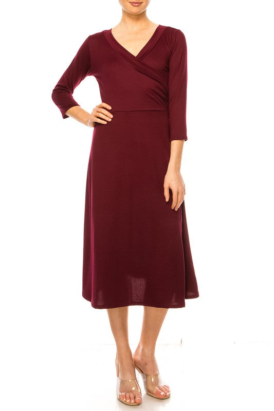 Solid faux wrap dress with deep V-neck Moa Collection