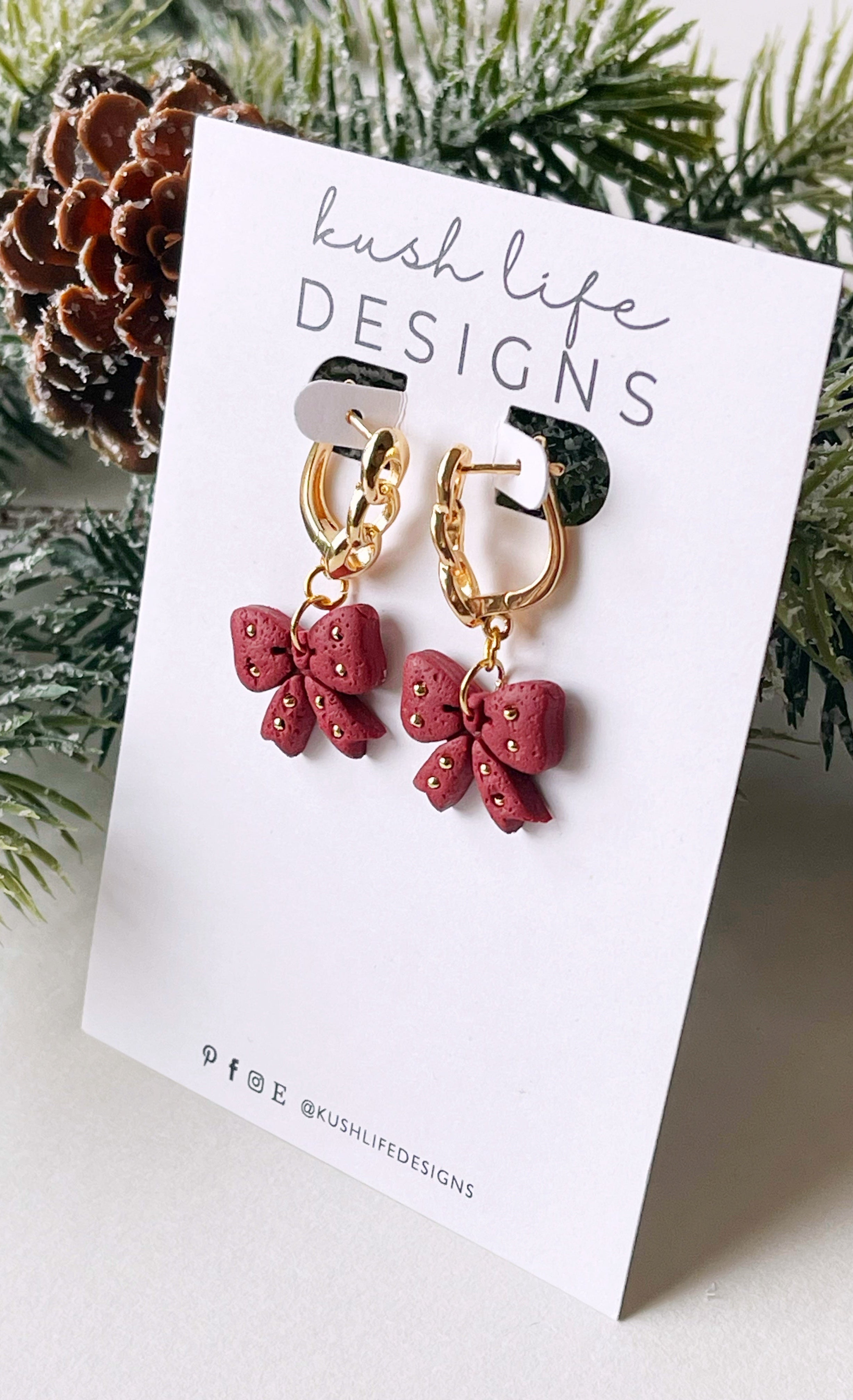 Clay Earrings | Embellished Maroon Bow on Gold Huggies Kush Life Designs