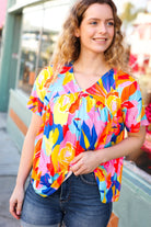 Orange & Yellow Geometric Floral V Neck Dolman Top Haptics