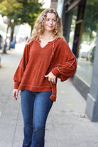 The Slouchy Rust Two Tone Knit Notched Raglan Top Haptics
