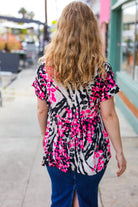 Take Me Away Pink Animal Print Babydoll V Neck Top Hayzel