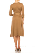 Solid faux wrap dress with deep V-neck Moa Collection