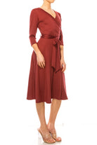 Solid faux wrap dress with deep V-neck Moa Collection