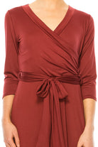 Solid faux wrap dress with deep V-neck Moa Collection