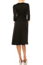 Solid faux wrap dress with deep V-neck Moa Collection