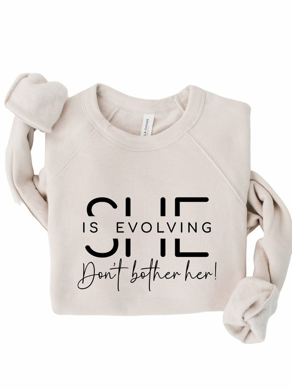 She is Evolving Bella Premium Sweatshirt Ocean and 7th