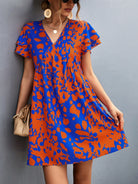 Ruffled Printed V-Neck Short Sleeve Mini Dress Trendsi