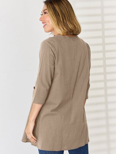 Pocketed Round Neck Half Sleeve Blouse Trendsi